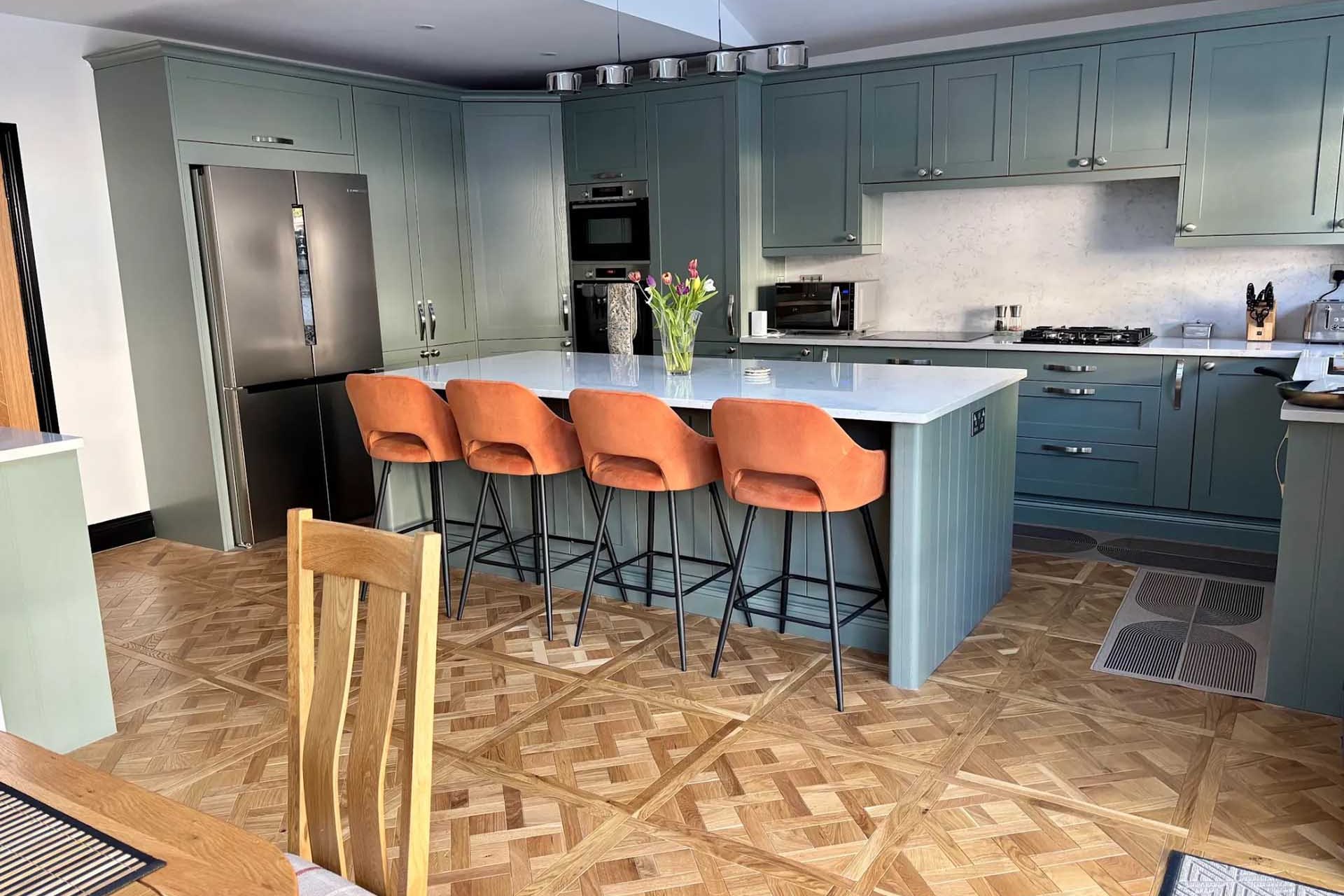 Navy kitchen with marble waterfall island
