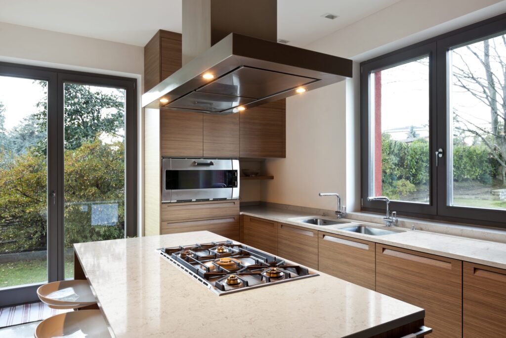 Header image of a full completed kitchen in walnut with silestone