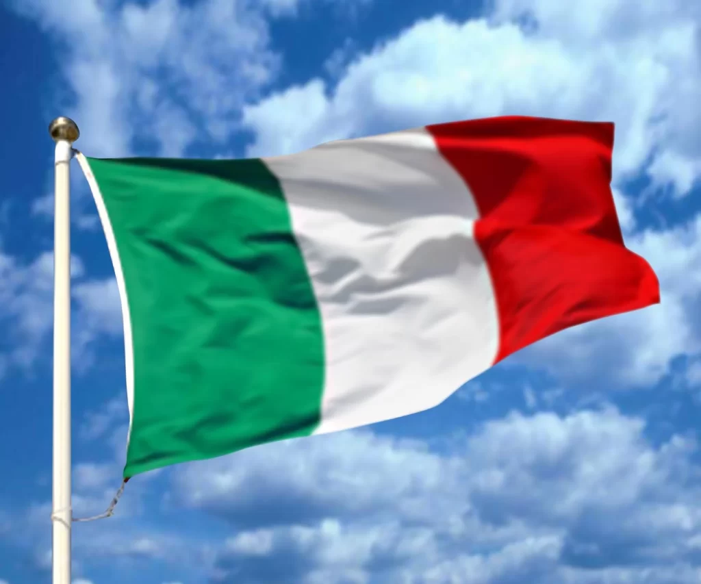 italian kitchens - italy flag waving with a sky background
