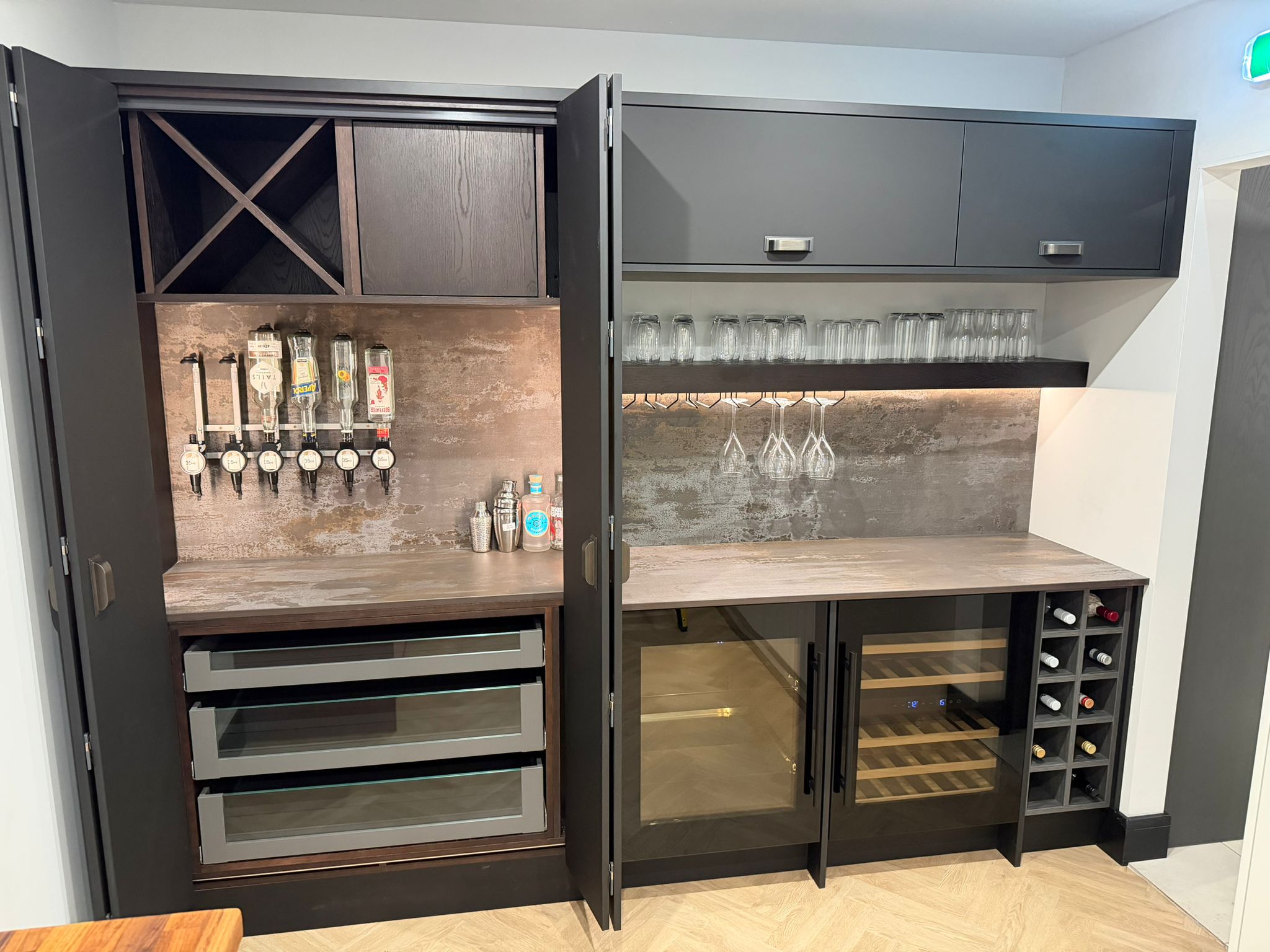 Bar area with bi-fold doors and Miro wine coolers located in the Beau Bijou Design German kitchen showroom in Hebden Bridge