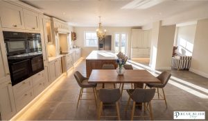 Beau Bijou Design. Hallas and Hill bespoke kitchen. musel and stained oak with Callacatta gold silestone worktops