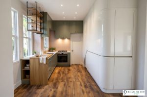 kitchen design ultra realistic render forest green and handleless white gloss. porcelain kitchen with Laminam Porcelain and timber worktops
