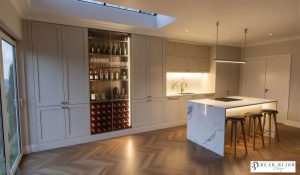 kitchen design ultra realistic render shaker timber porcelain kitchen with Laminam Porcelain worktops, bespoke wine unit