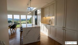 kitchen design ultra realistic render shaker timber porcelain kitchen with Laminam Porcelain worktops, crofts handles