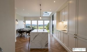 kitchen design ultra realistic render shaker timber porcelain kitchen with Laminam Porcelain worktops, bespoke wine unit
