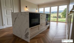 kitchen design ultra realistic render shaker timber porcelain kitchen with Laminam Porcelain worktops, integrated micro and oveen, crofts handles and bespoke wine unit,