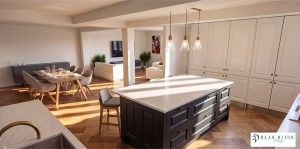 beau bijou design ultra realistic render. mussel traditional moulded shaker kitchen and graphite island with quartz worktops and timber floor